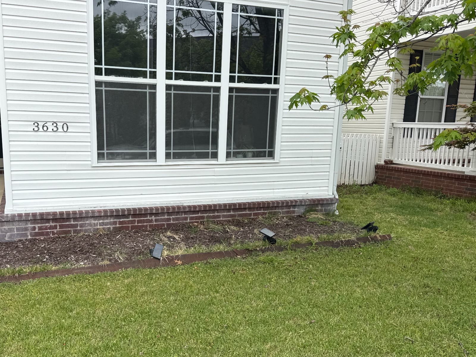 White home garden bed before renovation